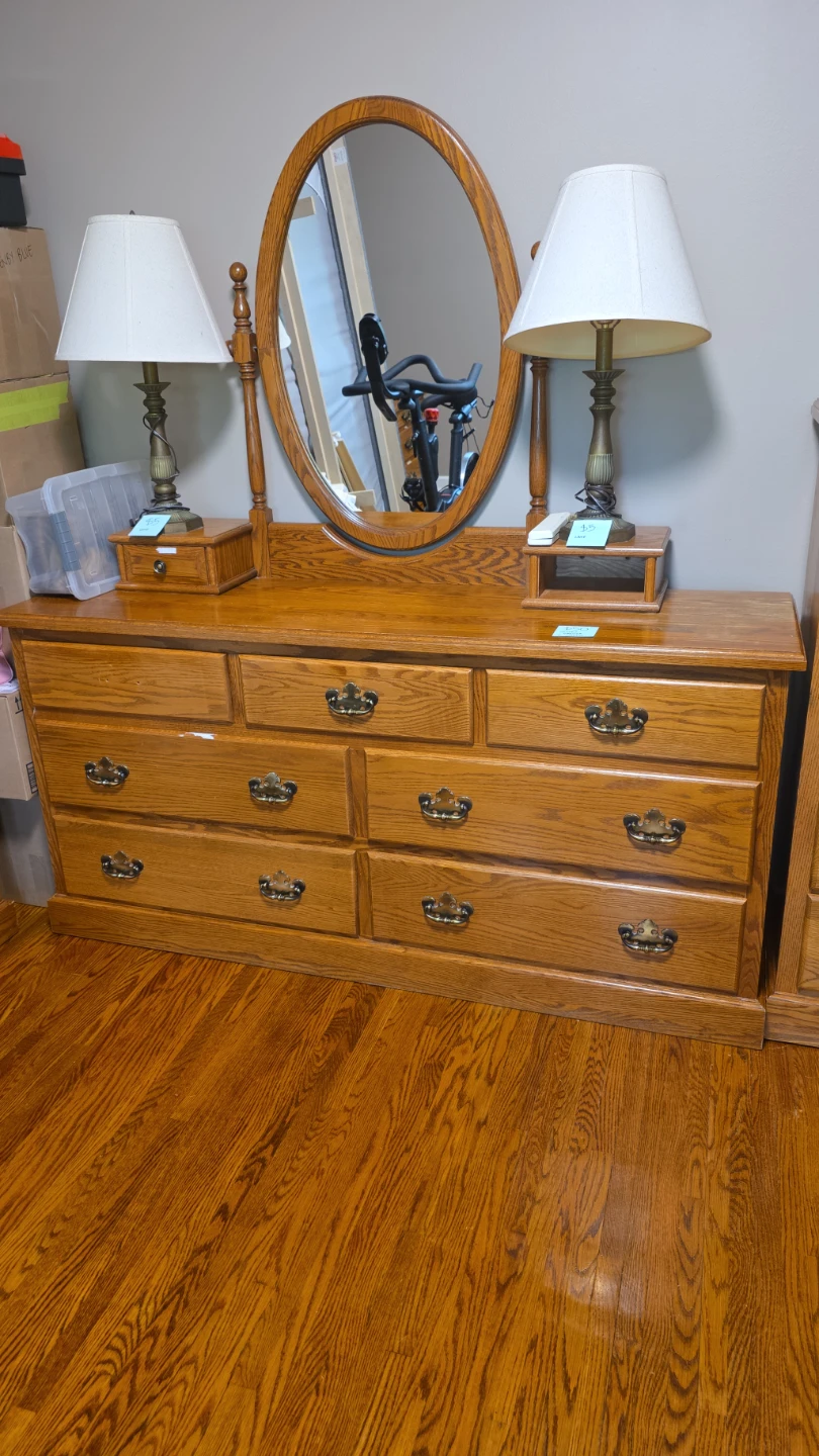 Wooden Dresser with Oval Mirror and Two Lamps