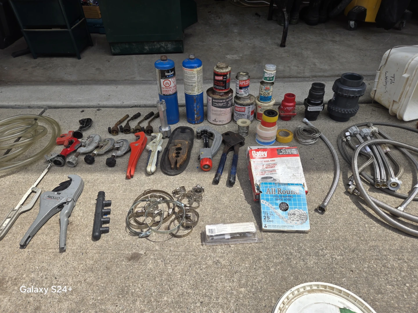 Assorted Pipe Wrenches and Plumbing Fittings