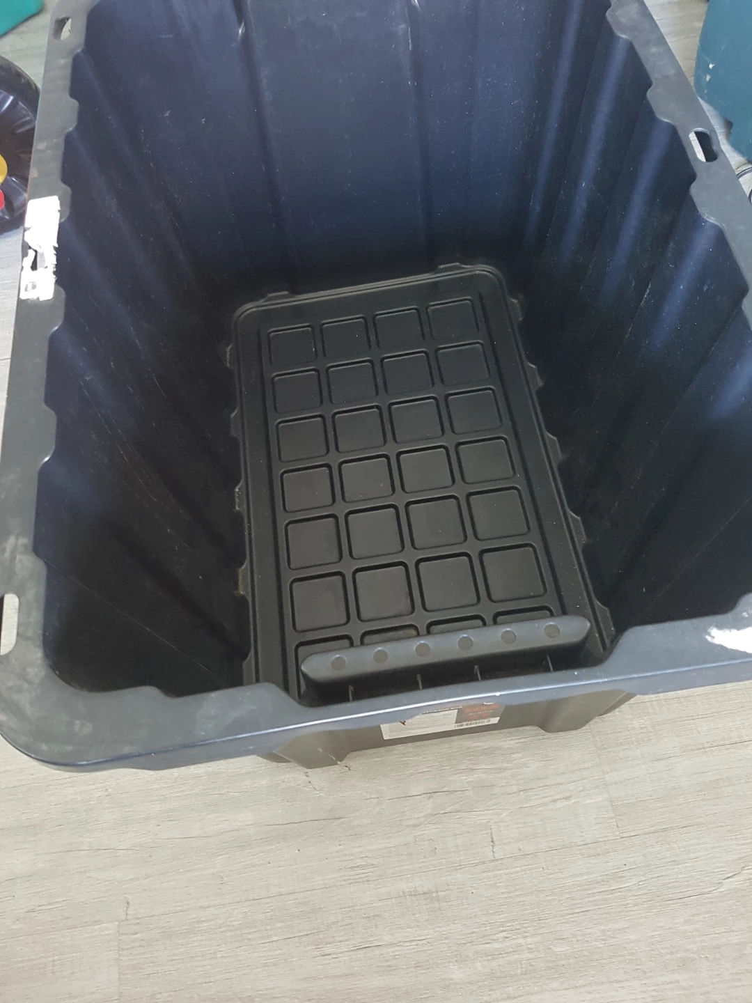 Large grey storage bin with lid