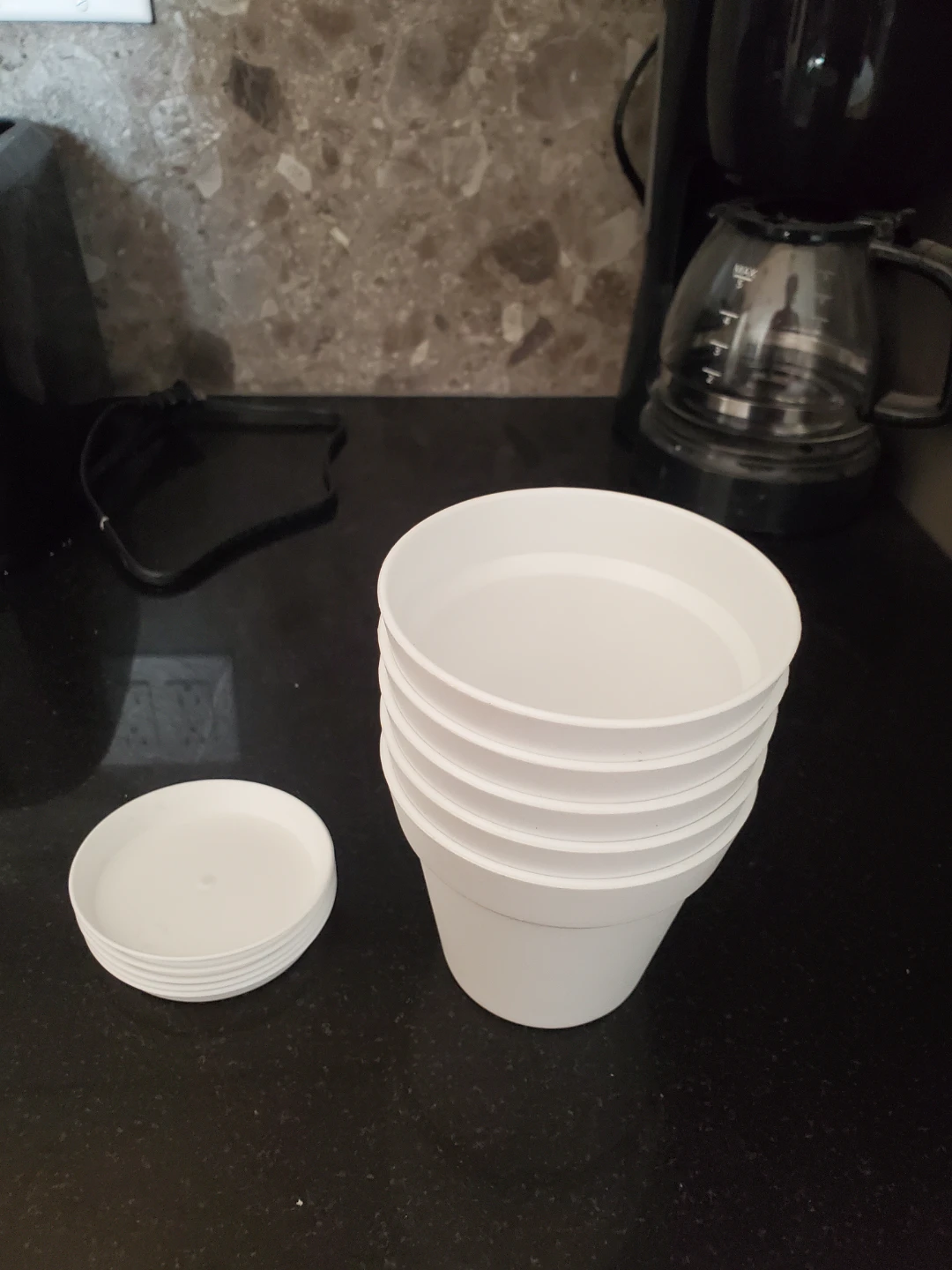 Stack of 5 White Plastic Plant Pots with drainage with Saucers