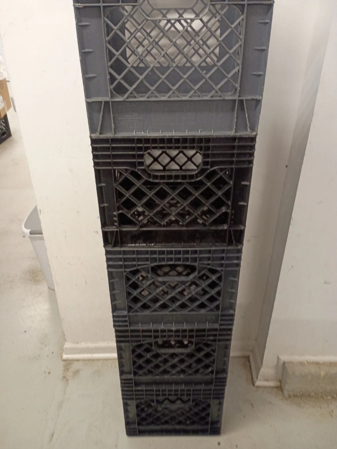 Stack of 4 Gray Plastic Milk Crates