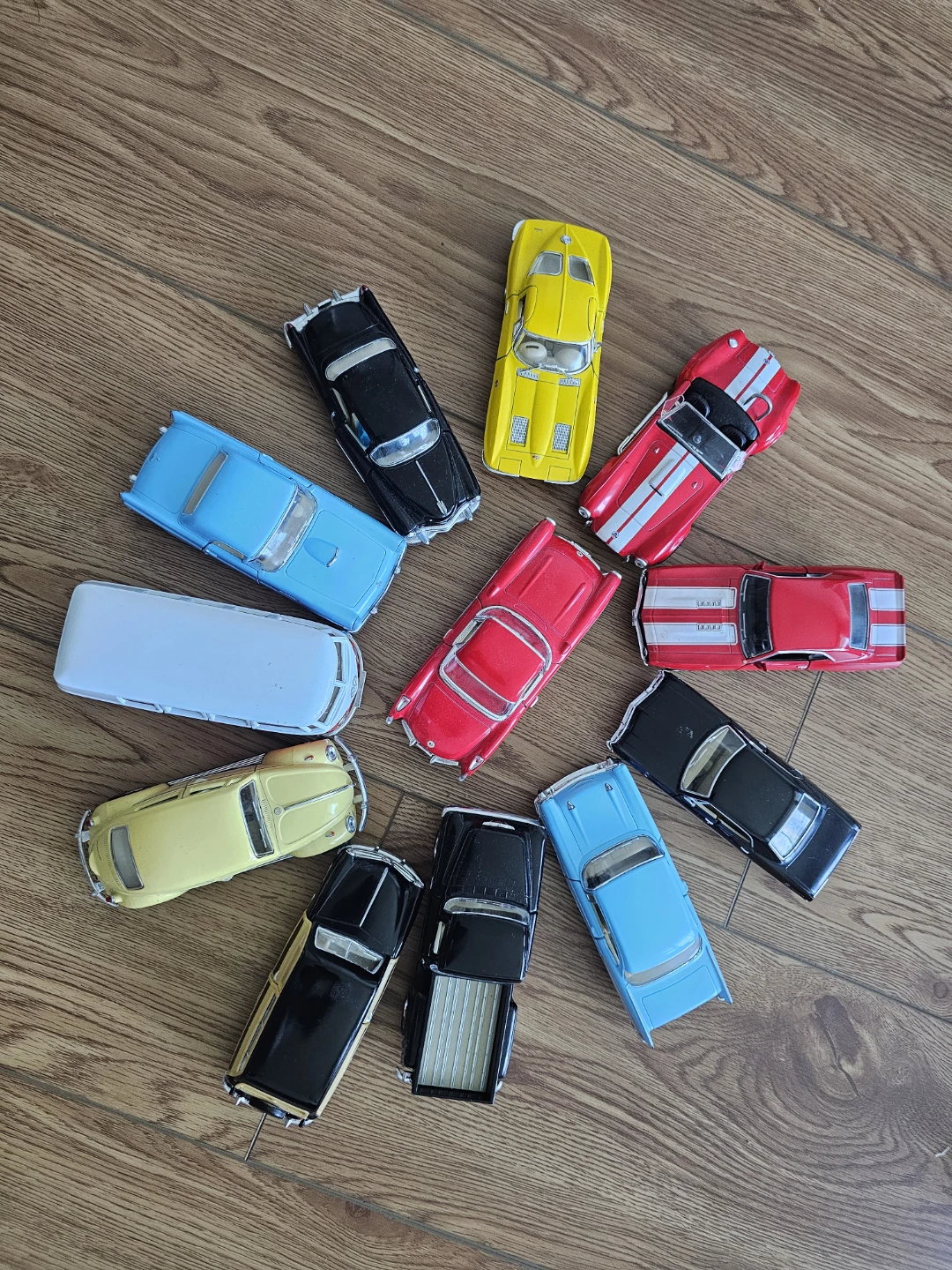 Assorted Toy Cars and Batman Action Figure