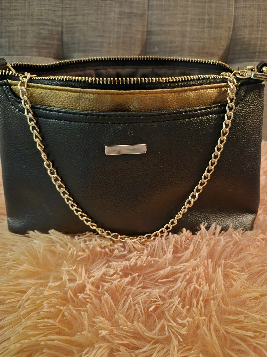 Black crossbody purse with gold chain