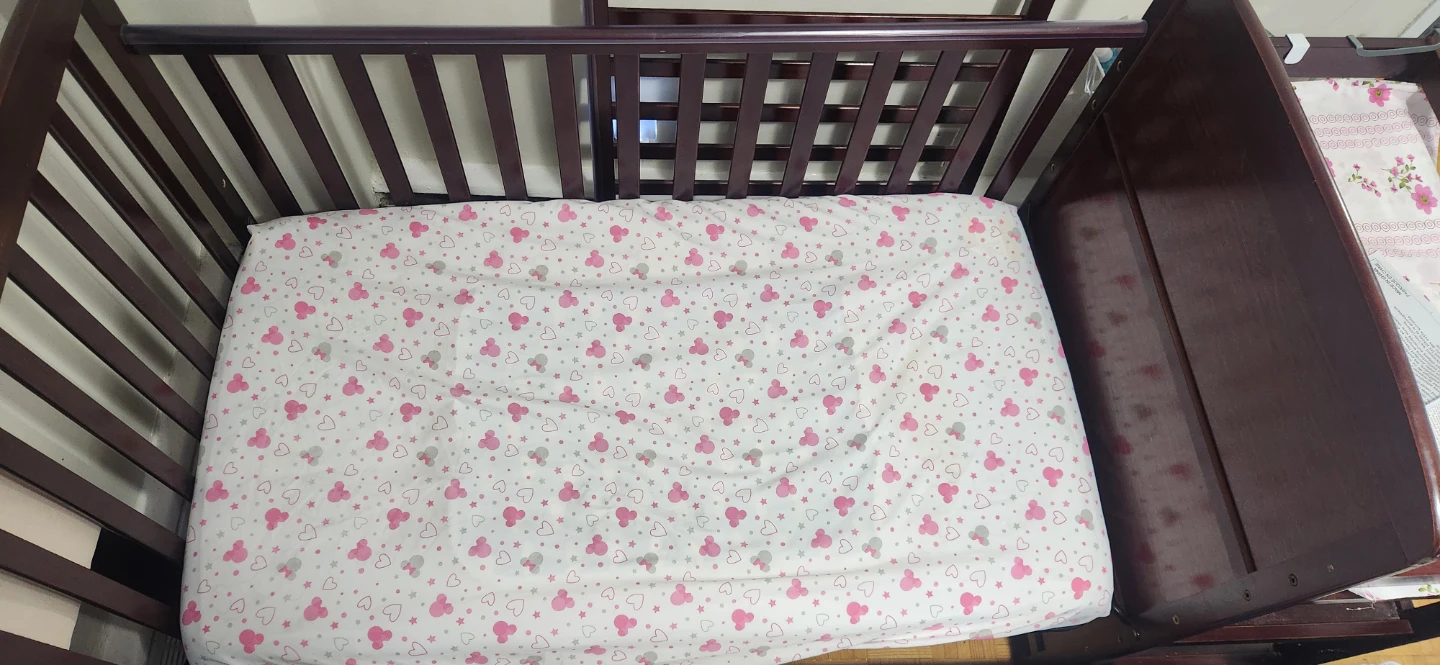 Dark Wood Crib comes with attached changing  table and  mattress