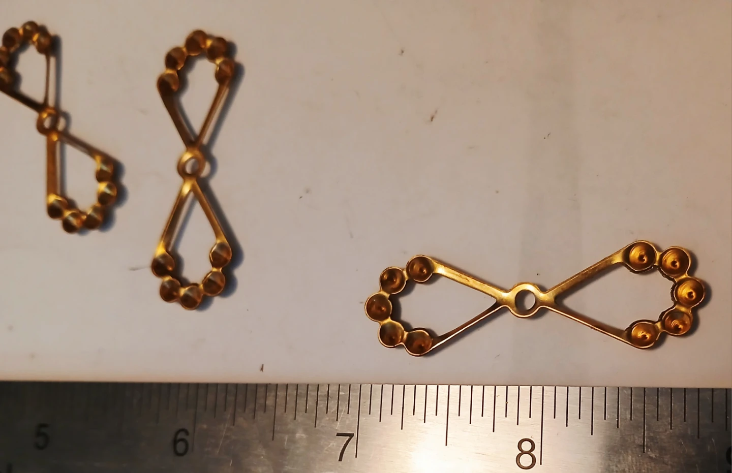 7 Brass Craft Embellishments - Snowflake & Bow Tie Shapes - photo 3