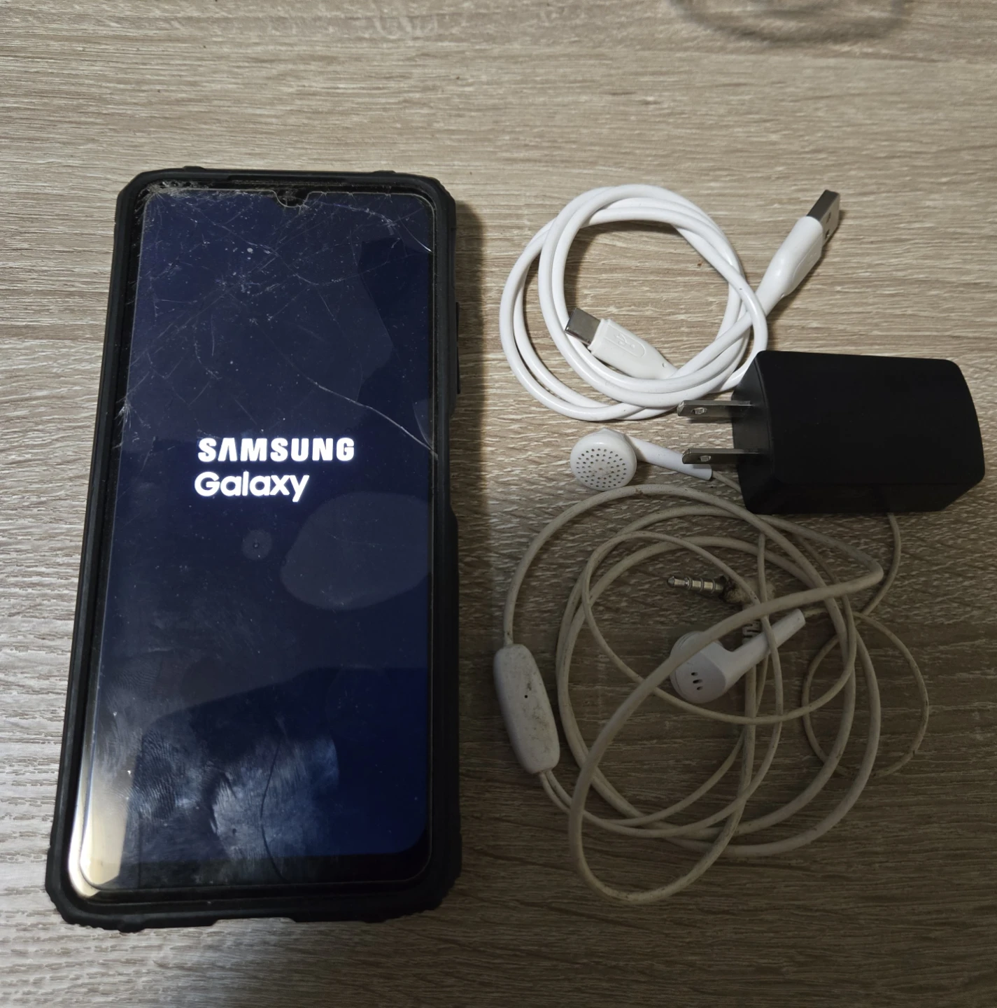 Samsung Galaxy A03 with Charger and Earbuds