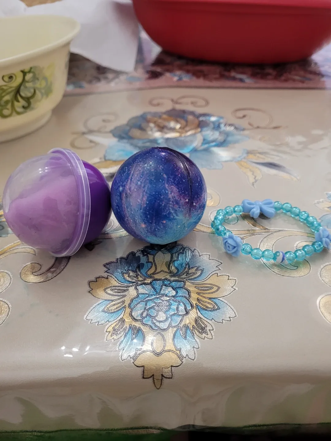 Purple  slime  bracelet and galaxy ball