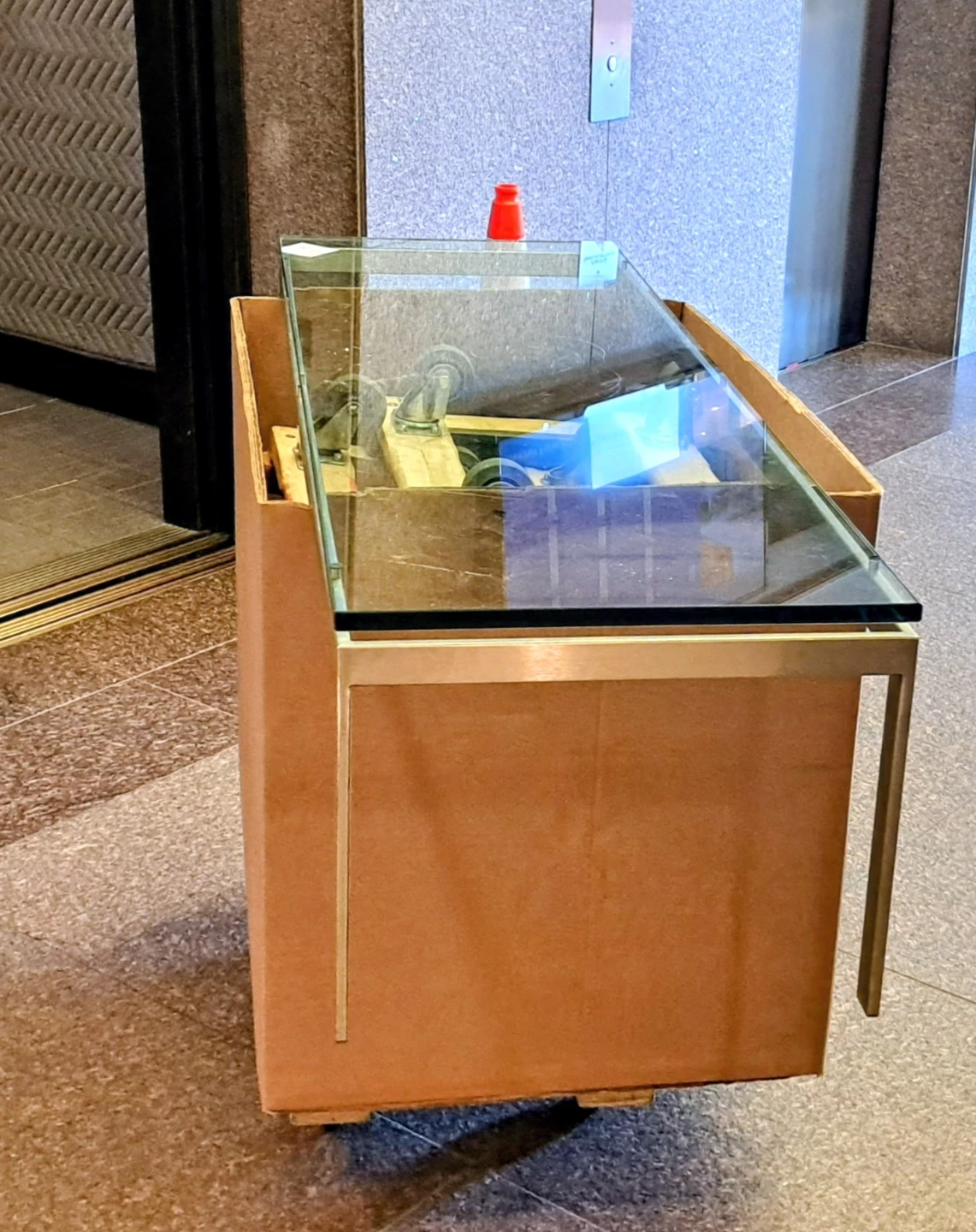Glass top coffee table with metal frame