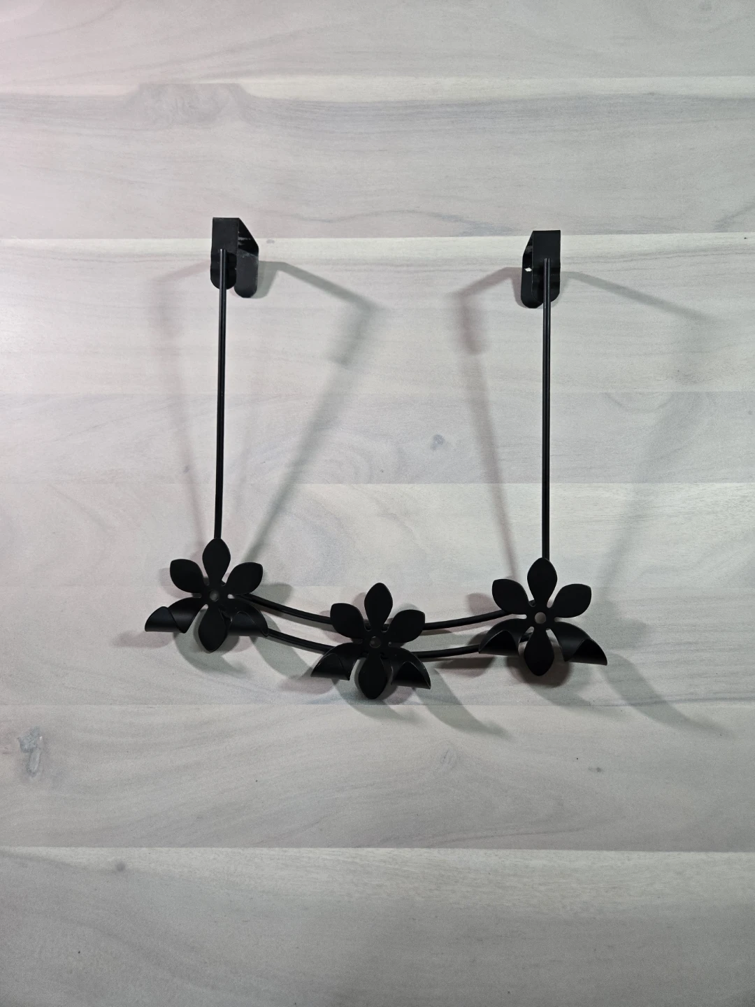 Black Metal Over-the-Door Hanger with Flower Accents