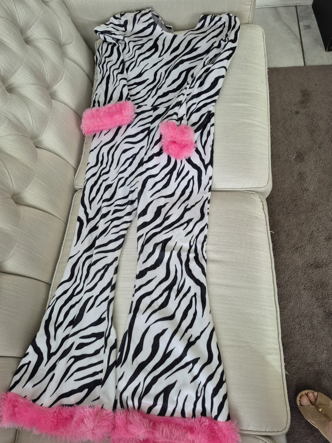 Zebra Print Flared Jumpsuit with Pink Fur Trim