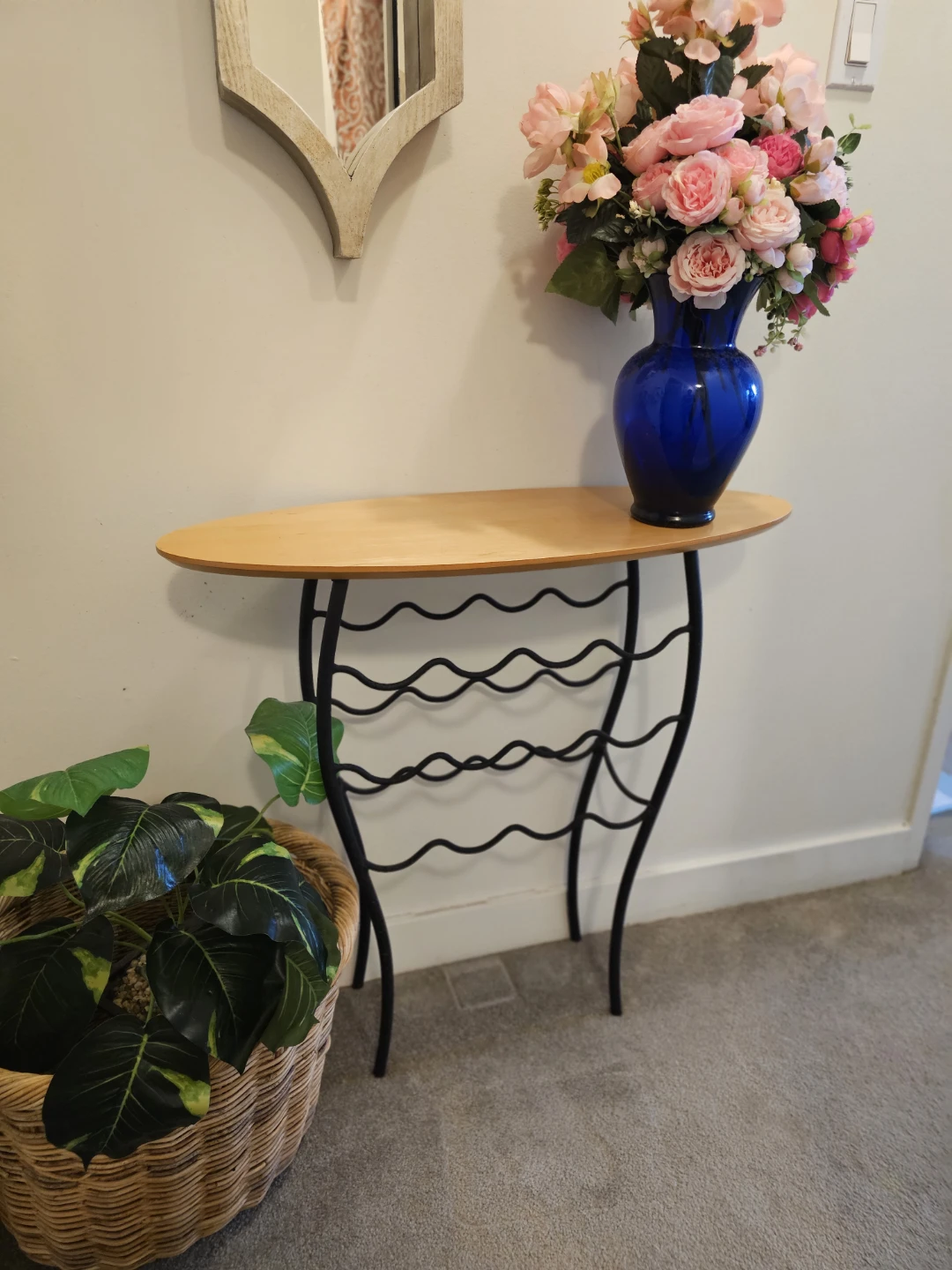 Oval Wood Top Console Table with Black Metal Wine Rack Base
