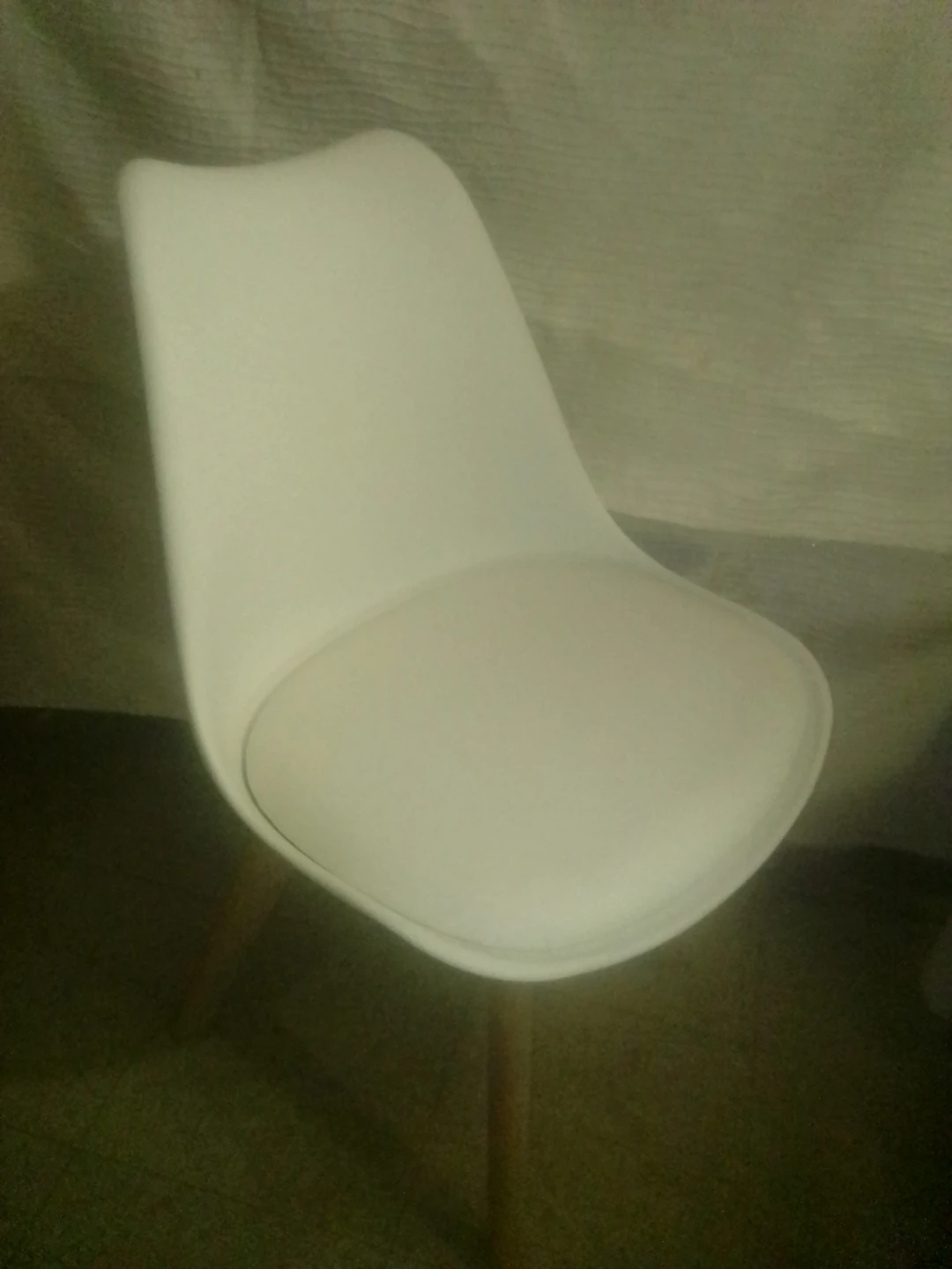 White accent chair with wooden legs