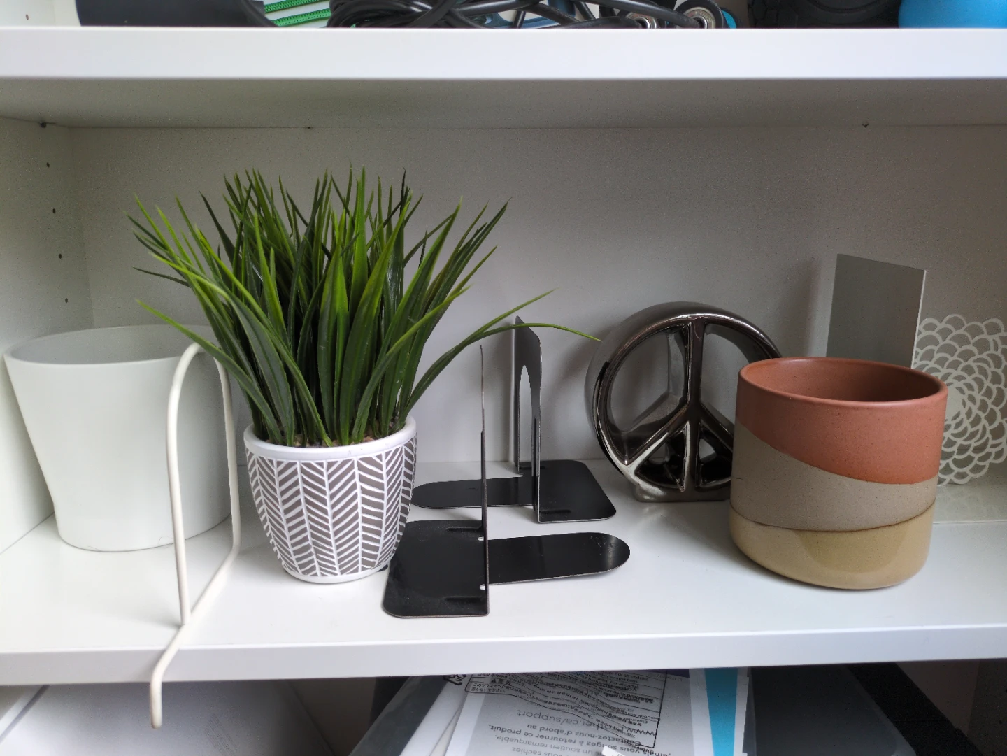 Various bookends, pots and shelf decor