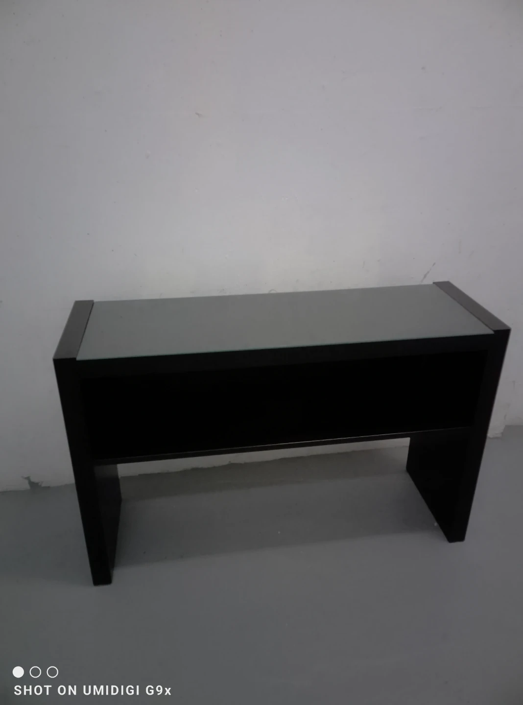 Black console table with glass top