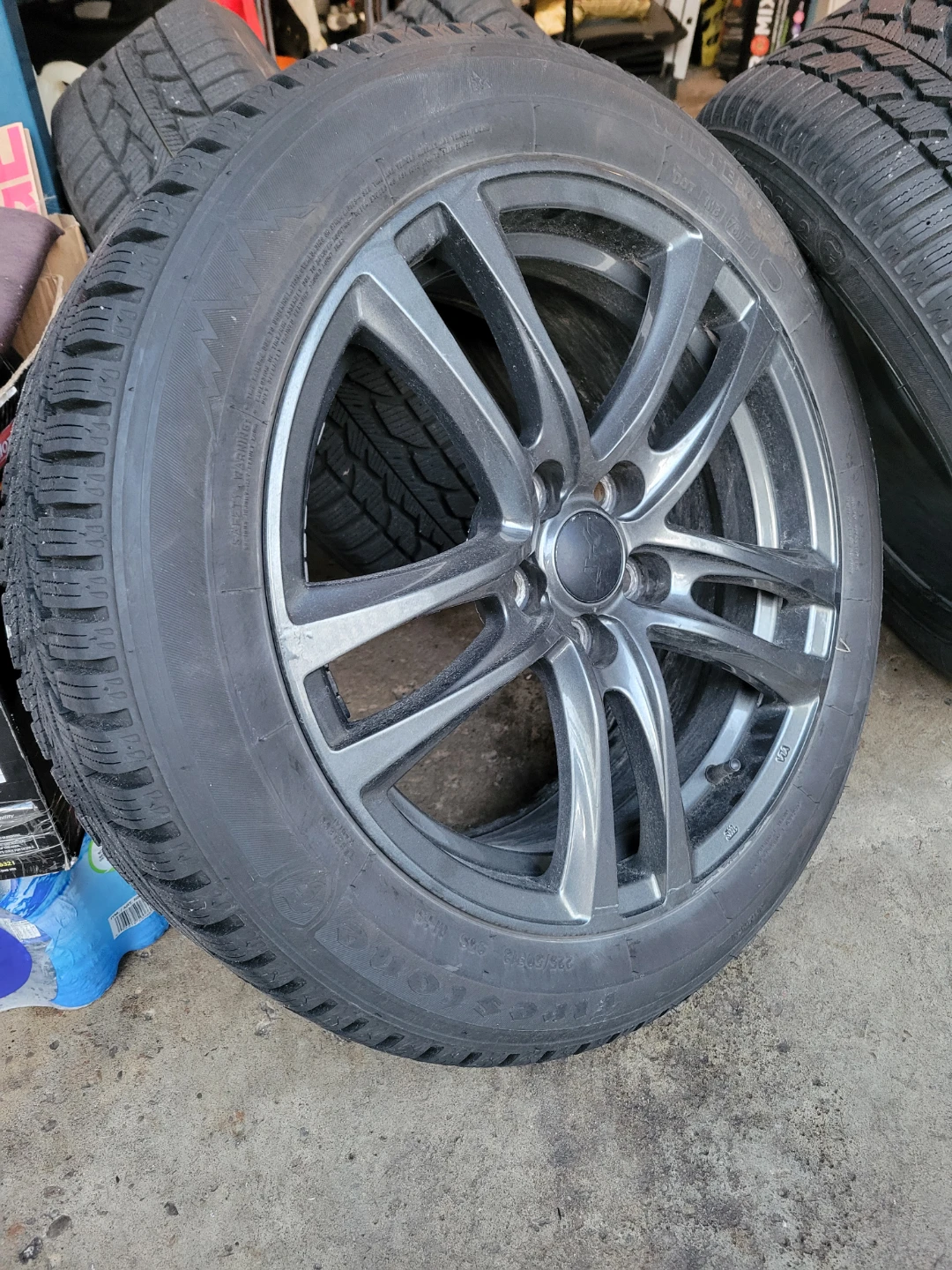 4 Firestone Winterforce II tires on alloy wheels.  225/50/18