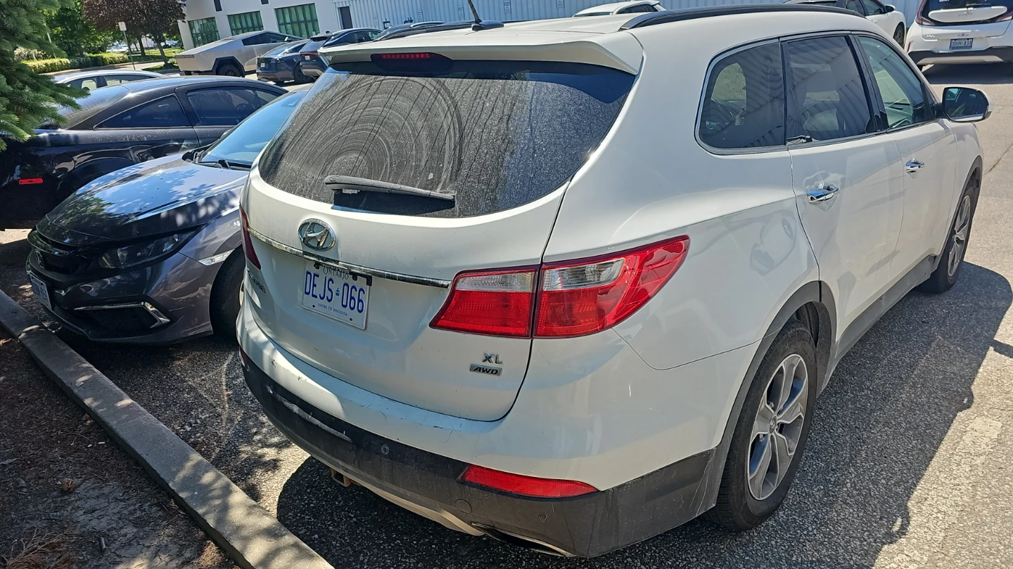White Hyundai Santa Fe SUV - photo 3