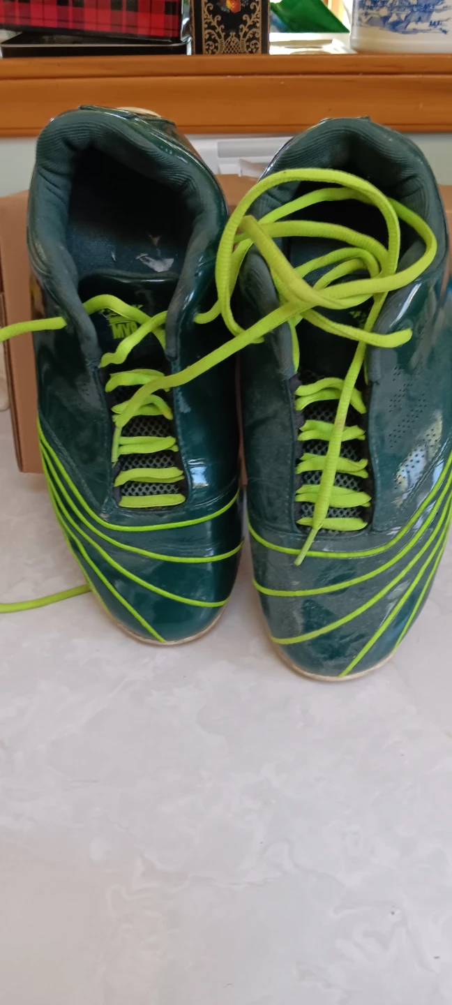 Green and yellow athletic shoes