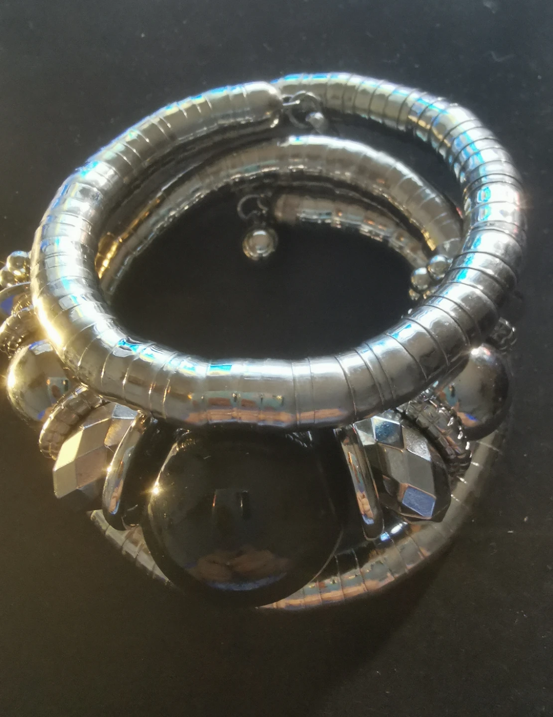 Silver-toned cuff bracelet with rose accent