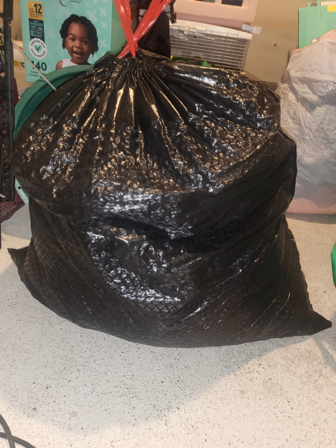 Garbage Bag full of lady's large clothes