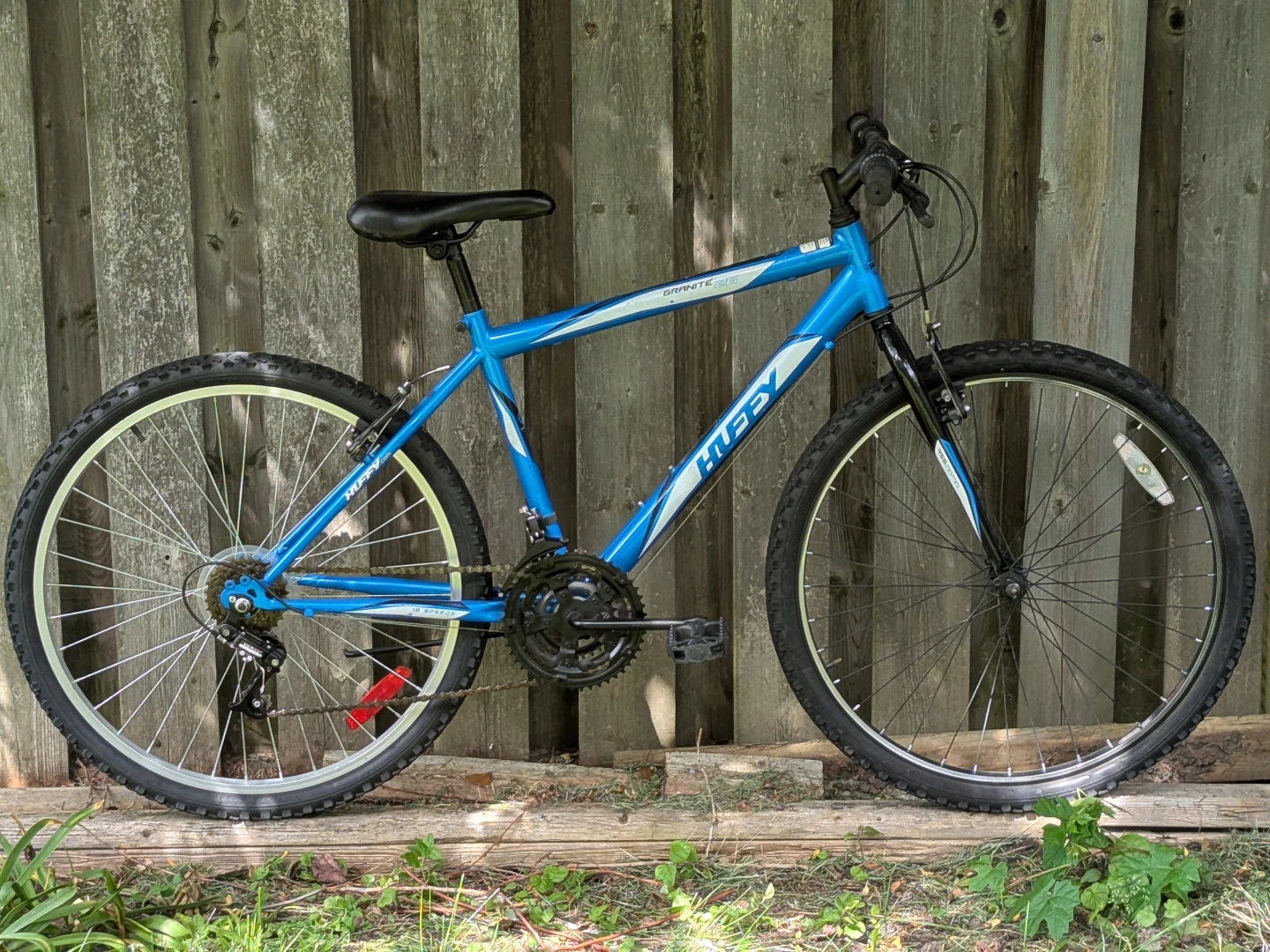 blue Huffy mountain bike, 26" wheels, size medium frame