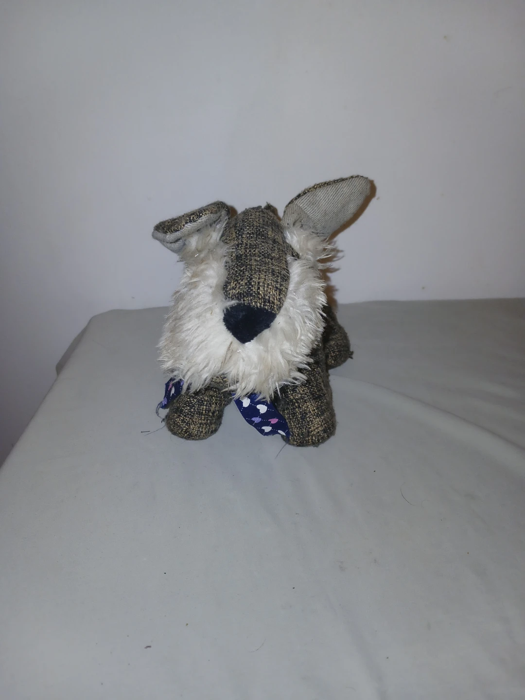 Plush dog toy with blue patterned bandana