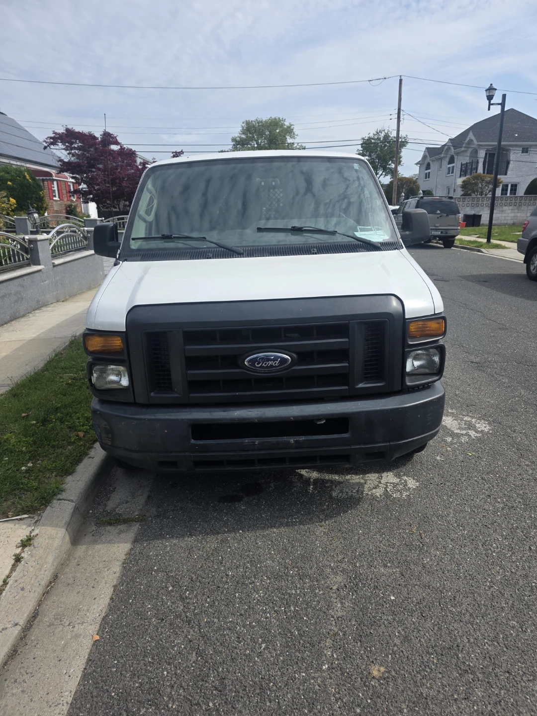 White Ford E-150 Van