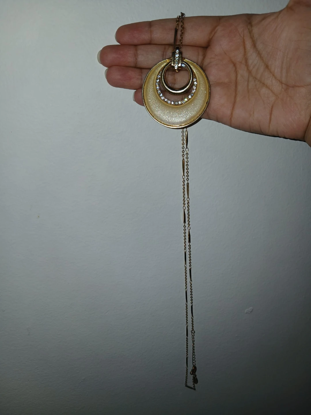 Gold tone pendant necklace with rhinestones
