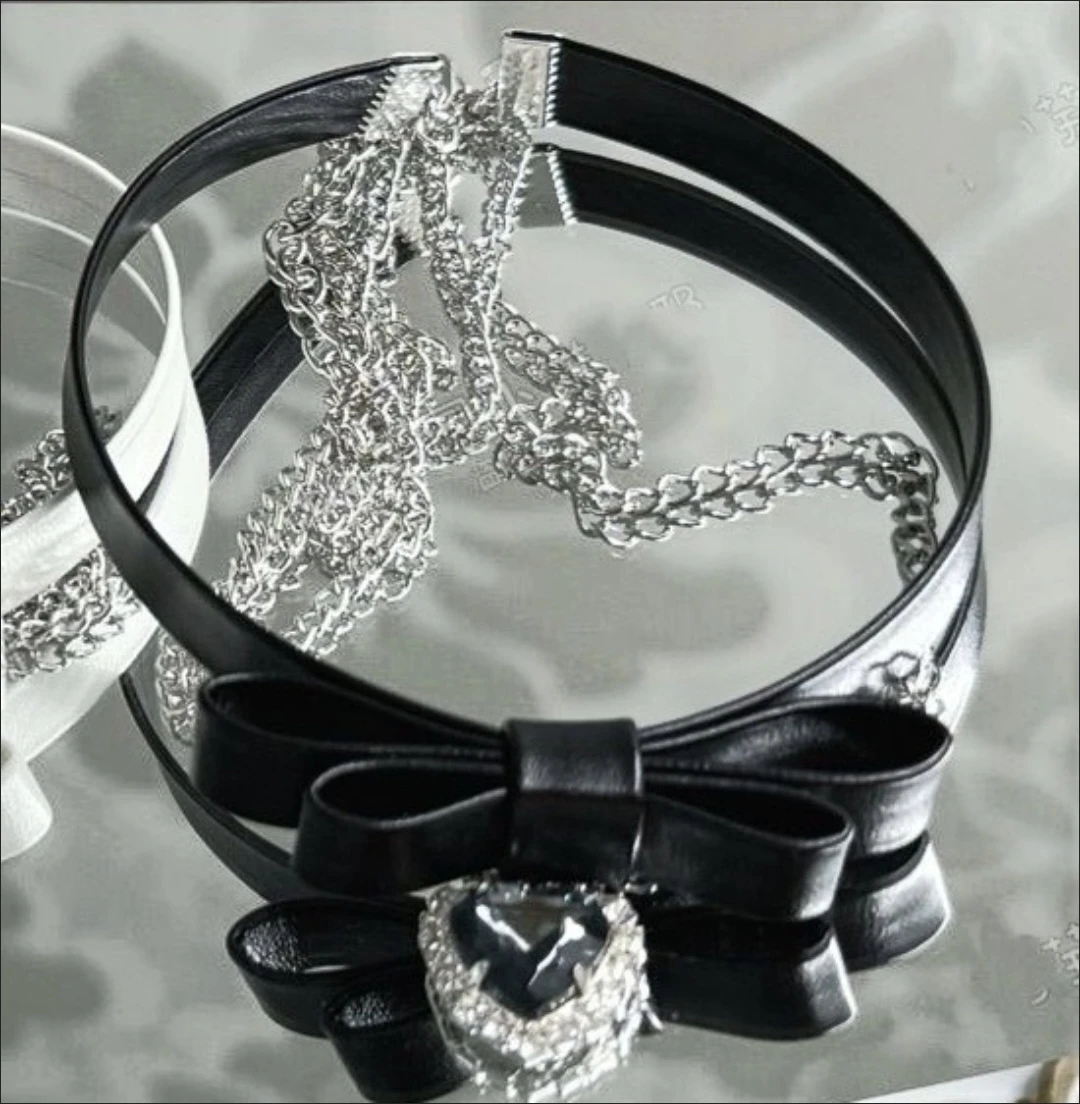 Black faux leather choker necklace with bow and heart gem