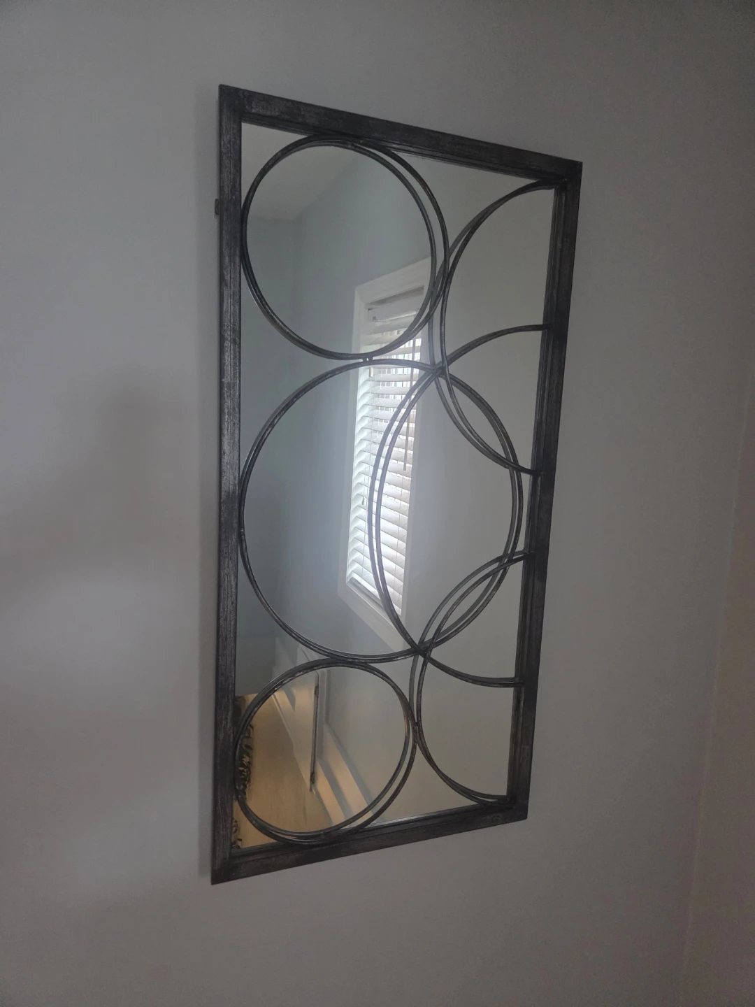 Decorative wall mirror with metal frame