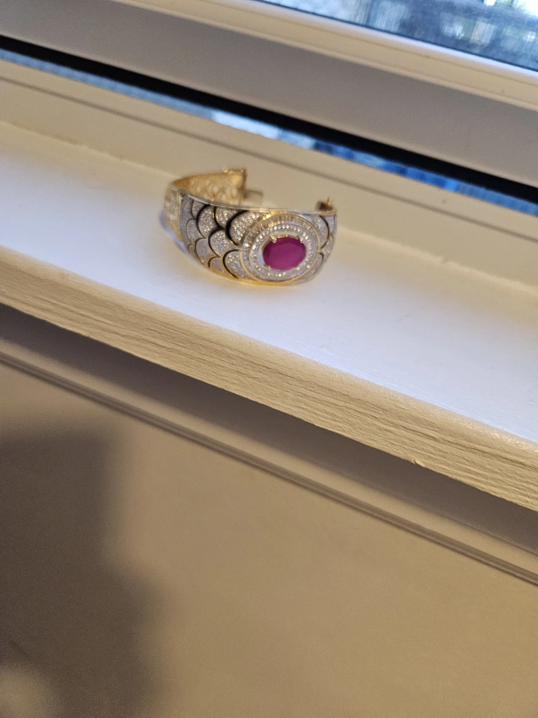 Gold Tone Bangle Bracelet with Pink Stone Accent