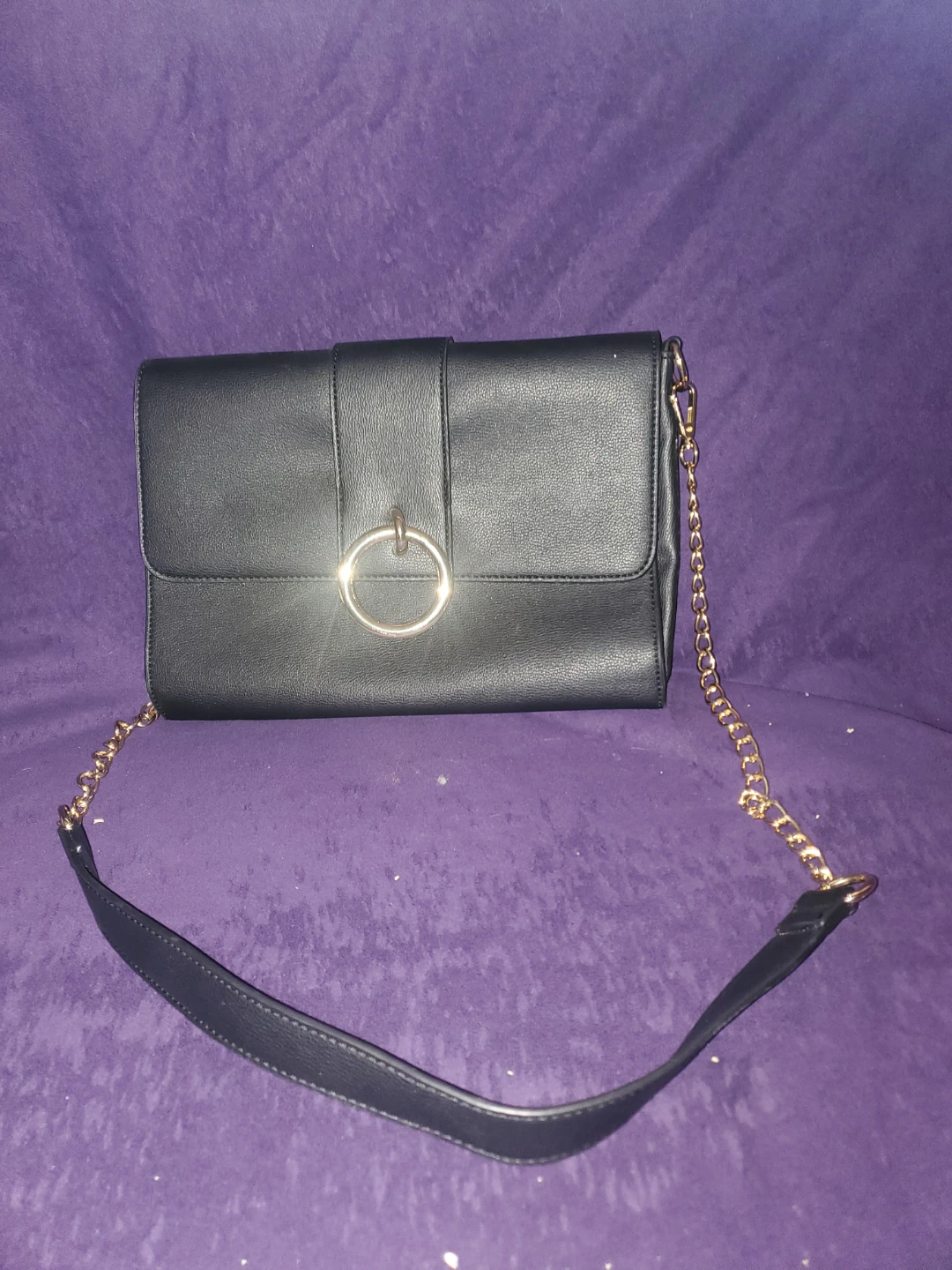 Black clutch purse with gold chain strap