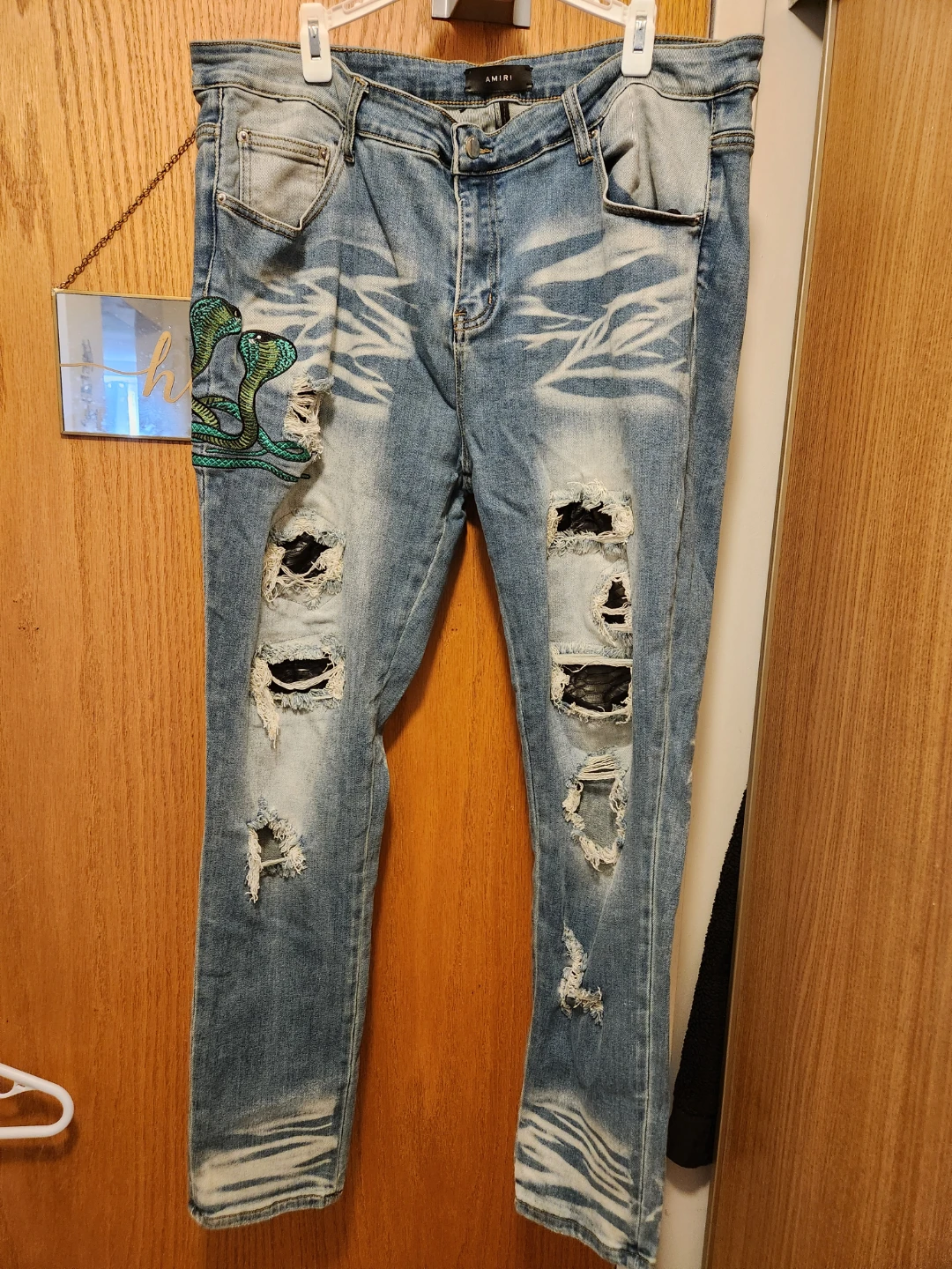 AMIRI Distressed Jeans with Cobra Patch