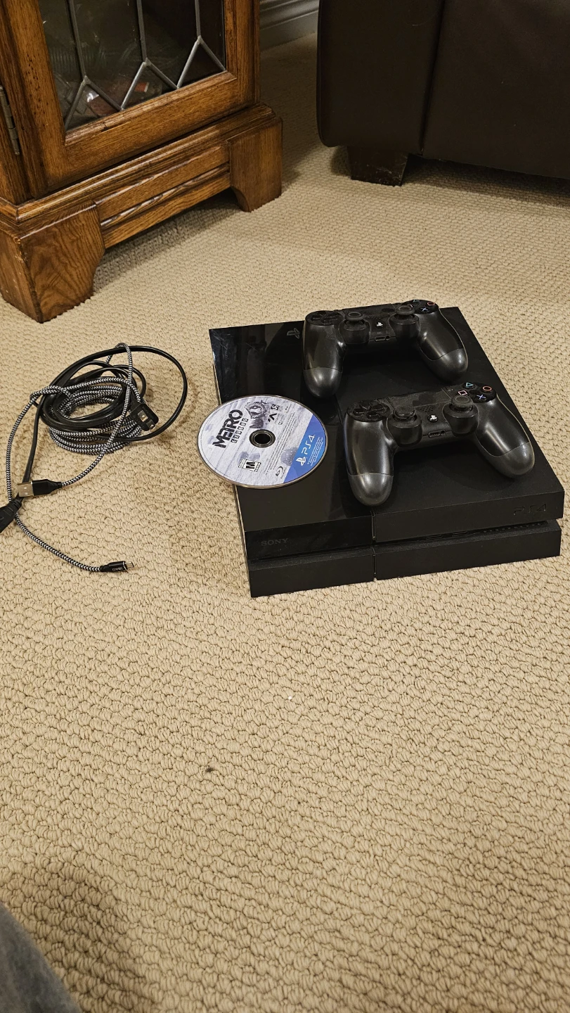 PlayStation 4 Console with 2 Controllers and Games