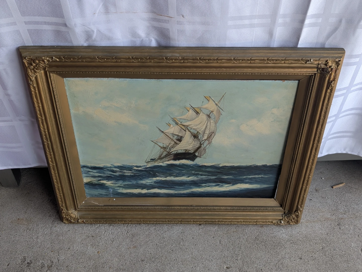 Framed Painting of a Ship at Sea