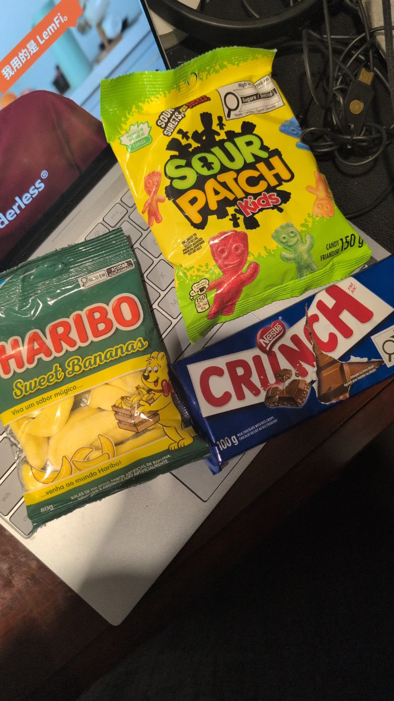 Sour Patch Kids, Haribo Sweet Bananas, and Nestle Crunch bar