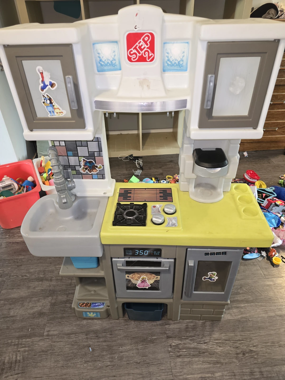 Two play kitchens with food