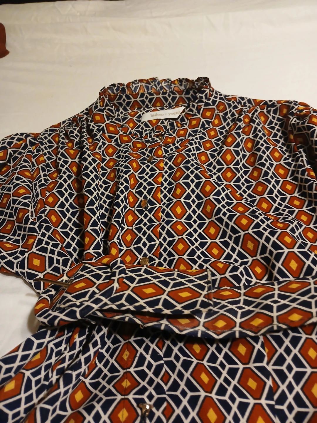 Bishop and young designer dress