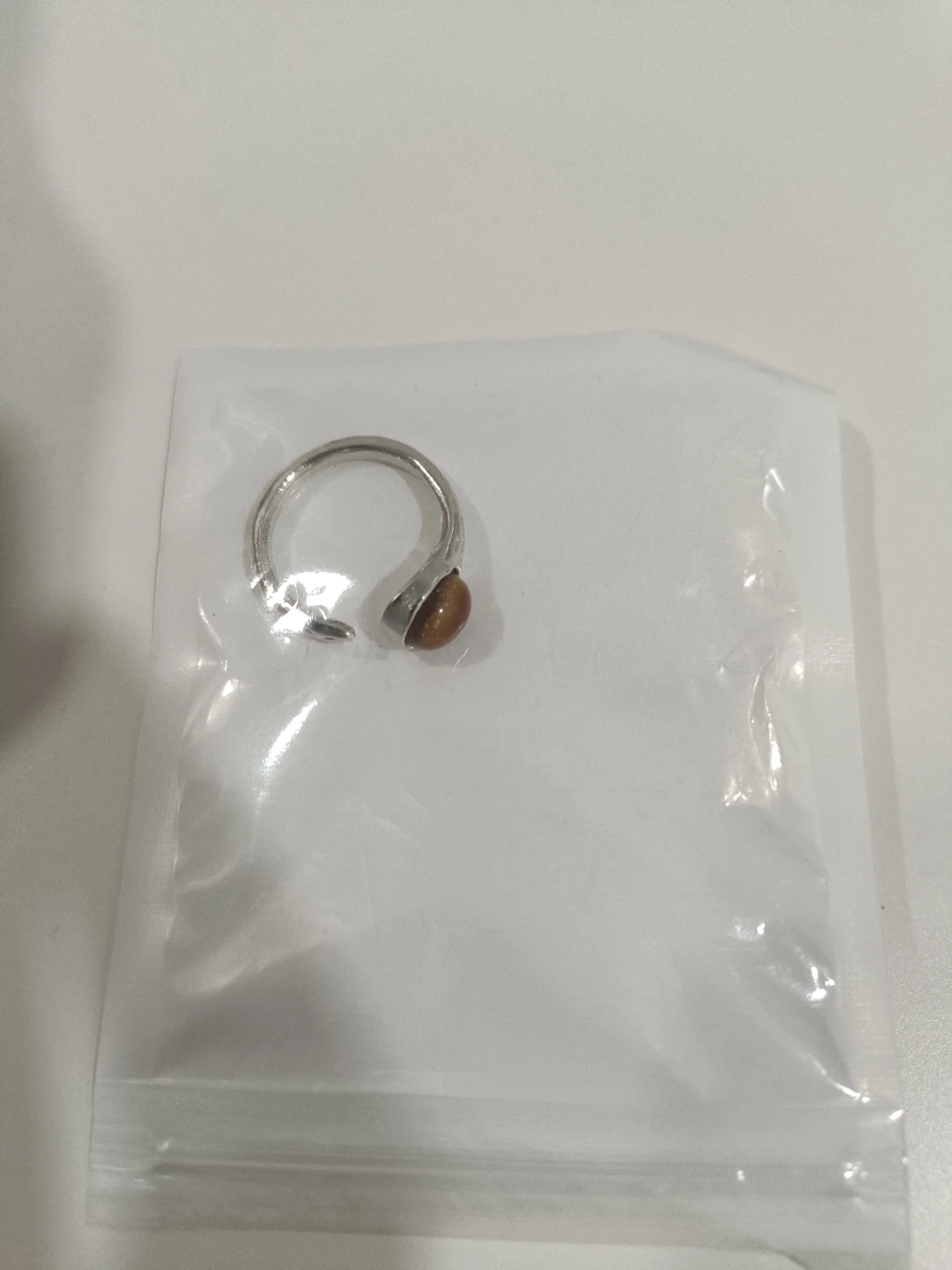 Silver ring with brown stone