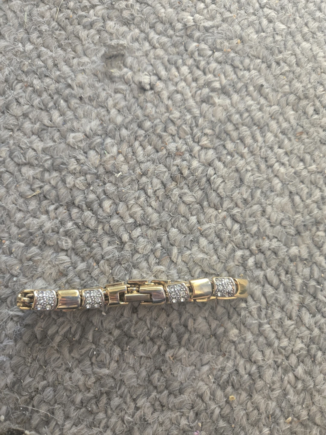 Gold tone bracelet with rhinestones