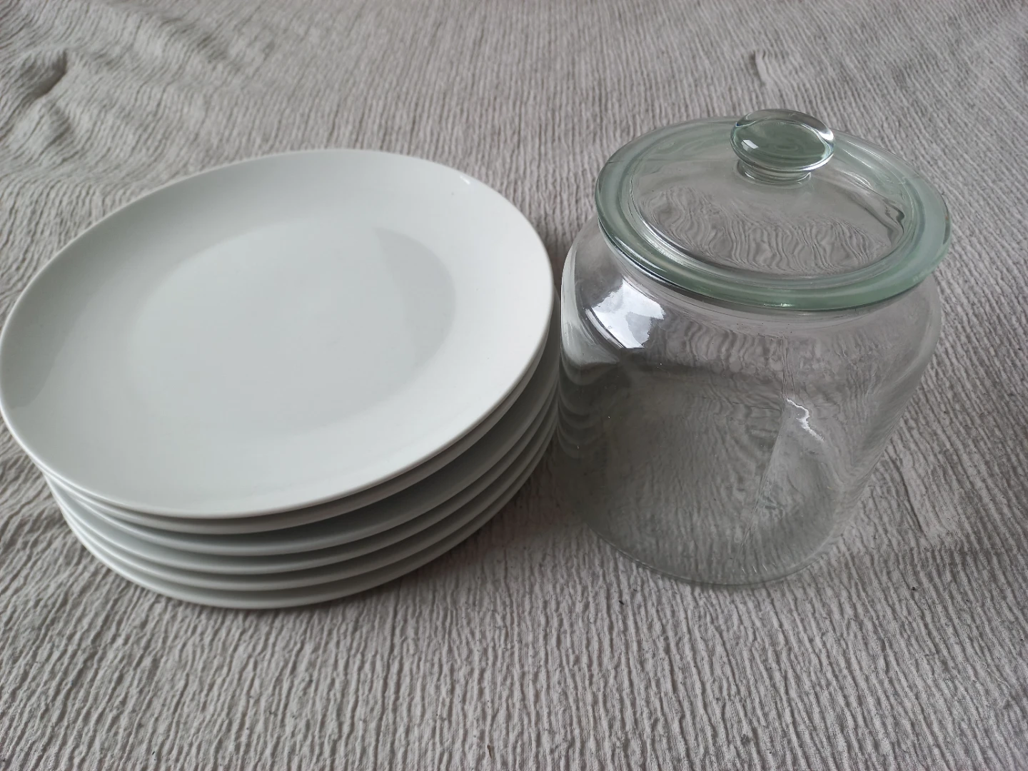 Stack of 6 White Plates and Glass Jar with Lid