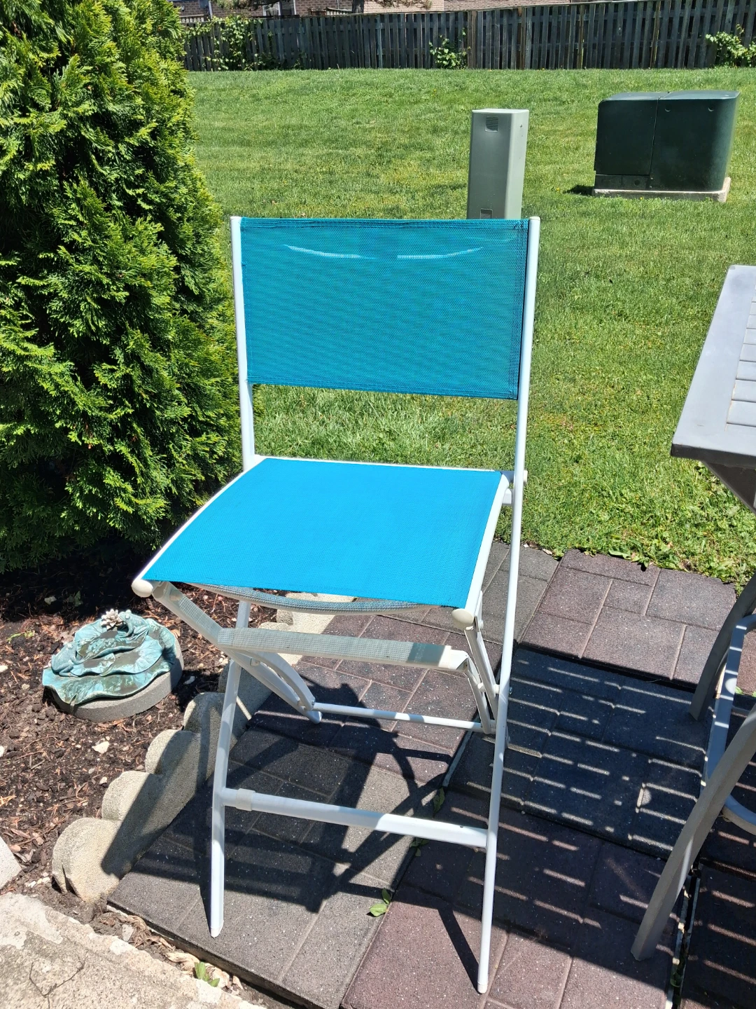 Blue Folding Patio Chairs and Grey Table.