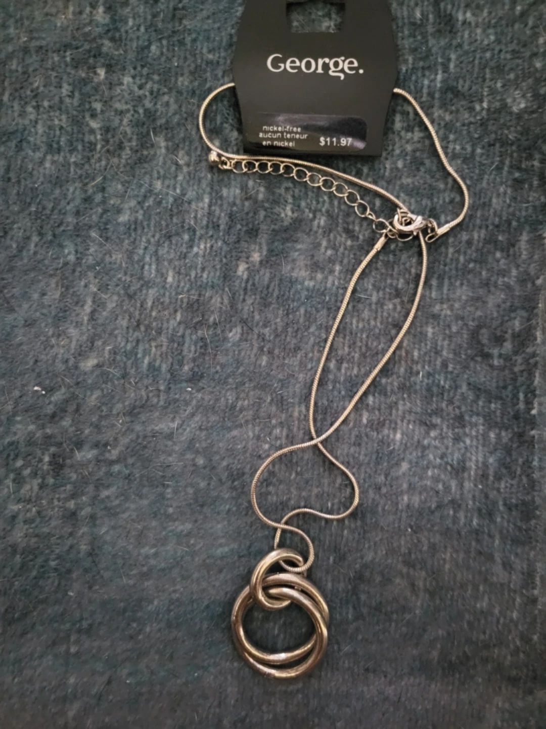 George. Silver Tone Interlocking Rings Necklace