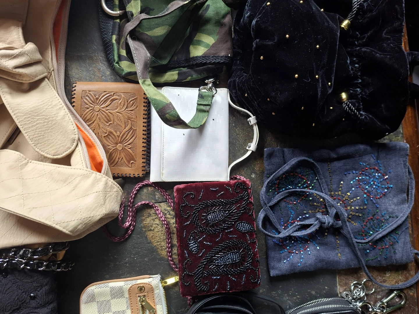 Assorted designer wallets and bags in wicker basket - photo 2