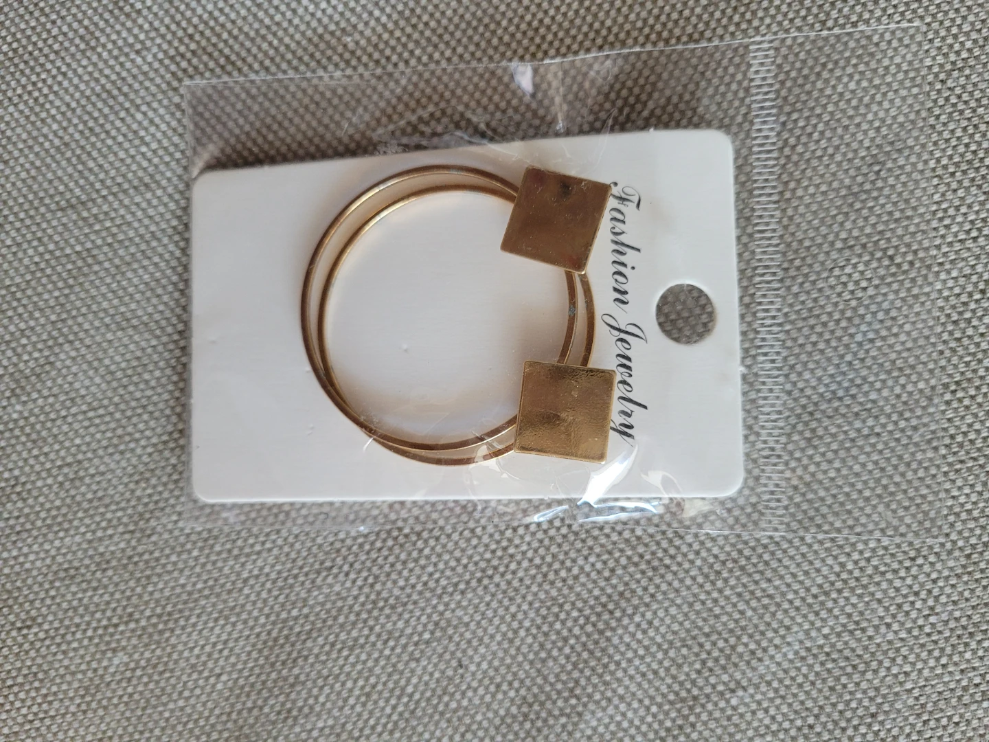 Gold tone hoop earrings with square detail