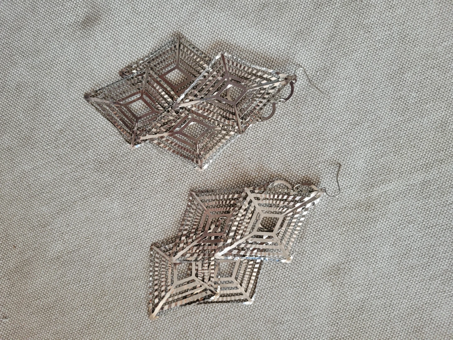 Silver tone geometric drop earrings
