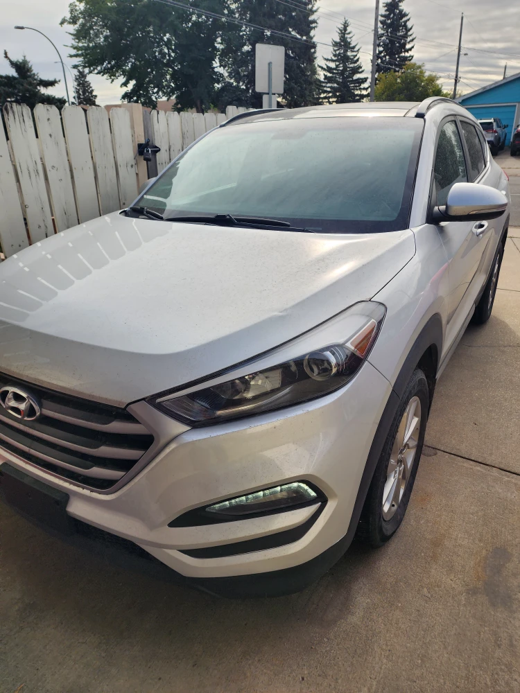 Silver Hyundai Tucson SUV - photo 2