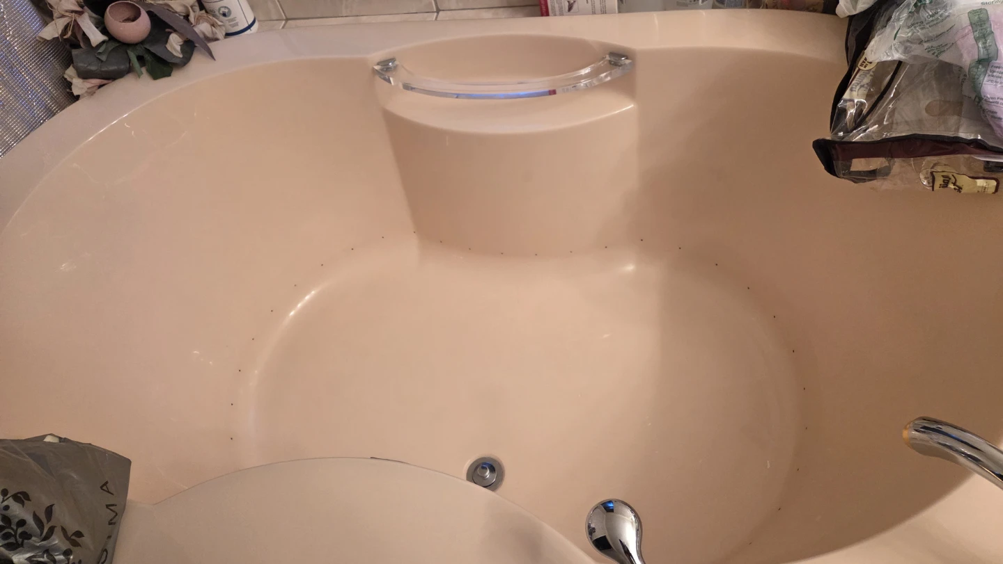 Pink coloured bathtub