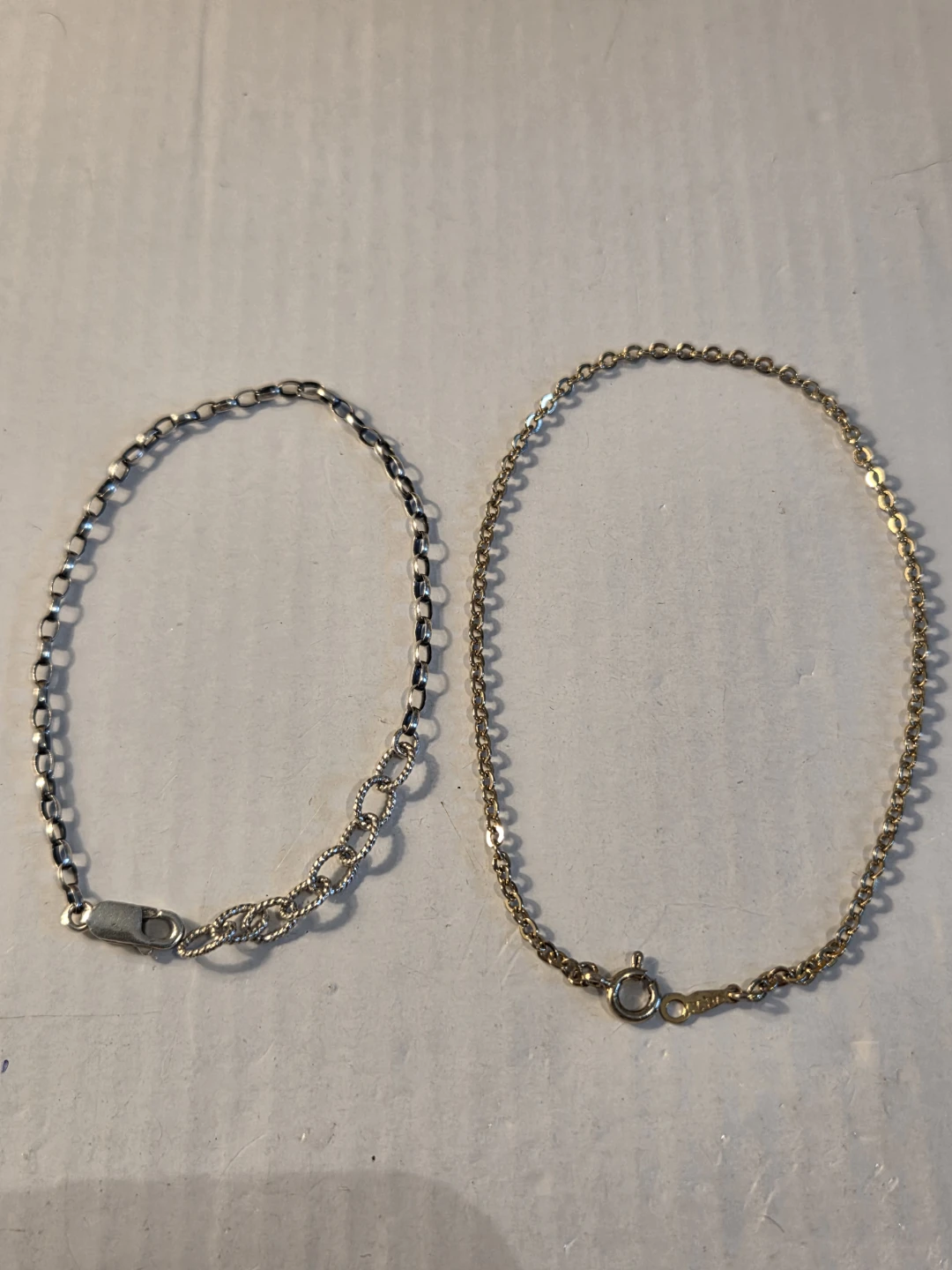 2 bracelets gold and sterling silver  and sterling silver