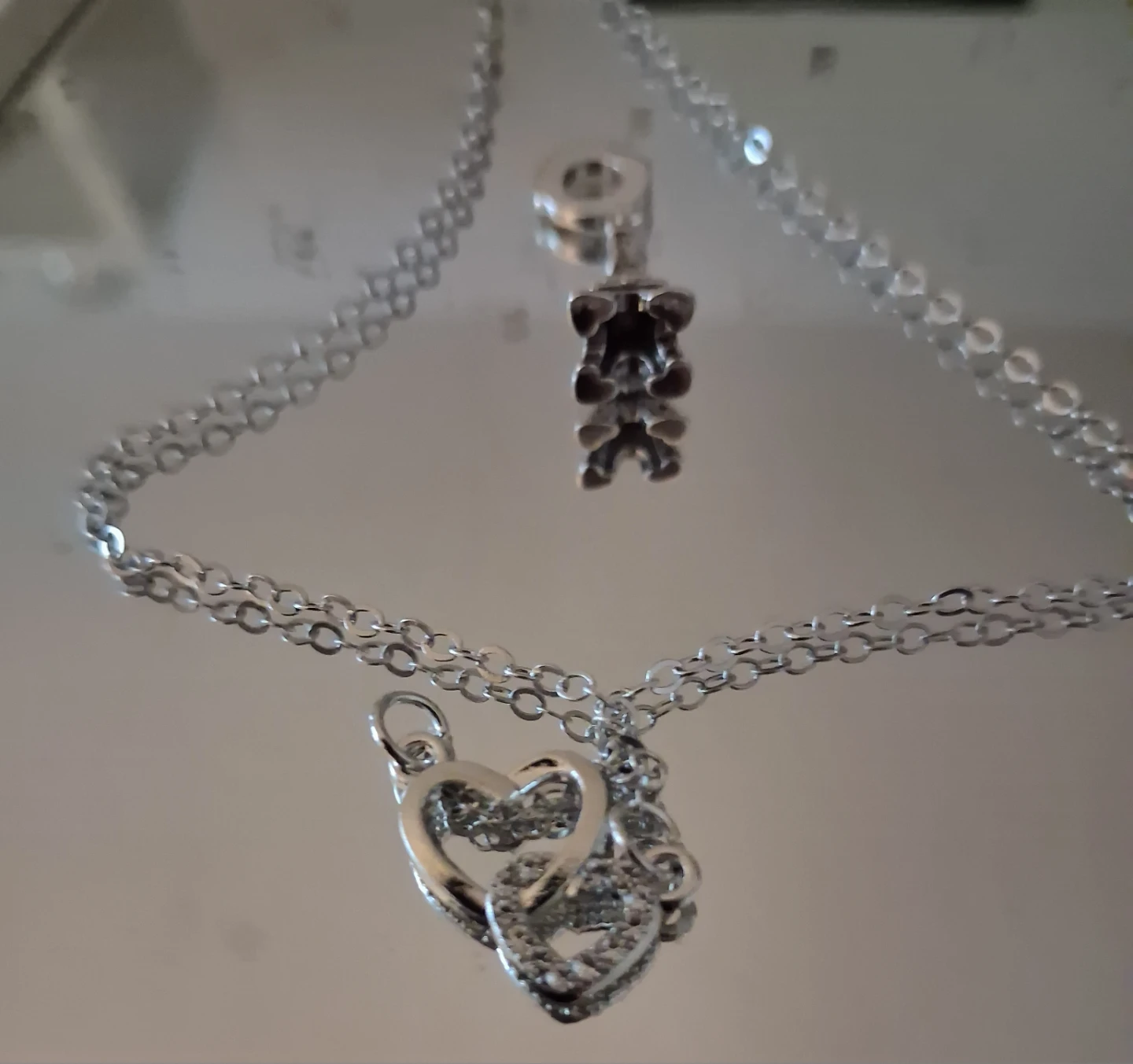 Necklace with interlocking hearts/eiffetower charm