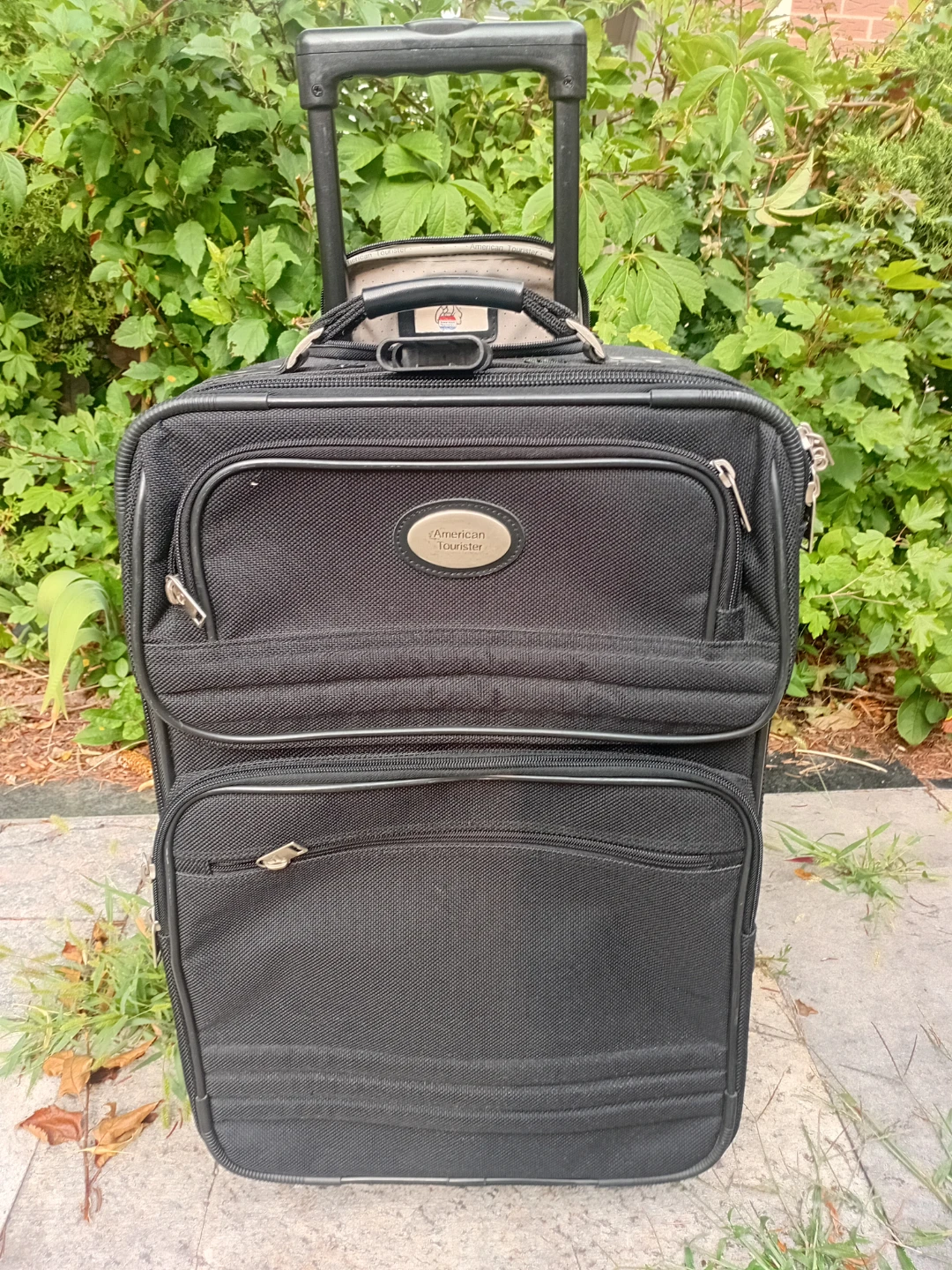 American Tourister Black Rolling Suitcase